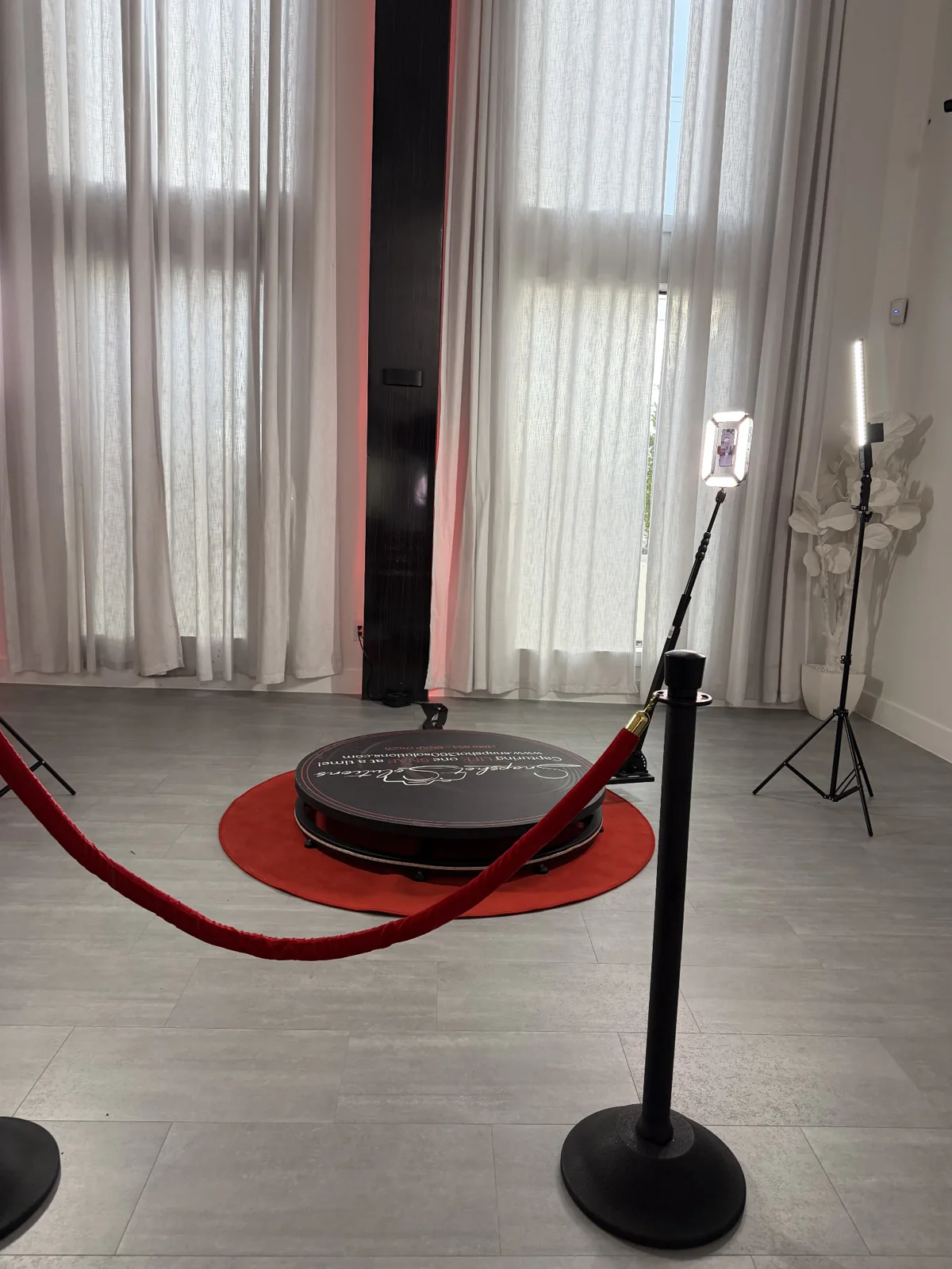 360 video booth platform with red carpet and lighting